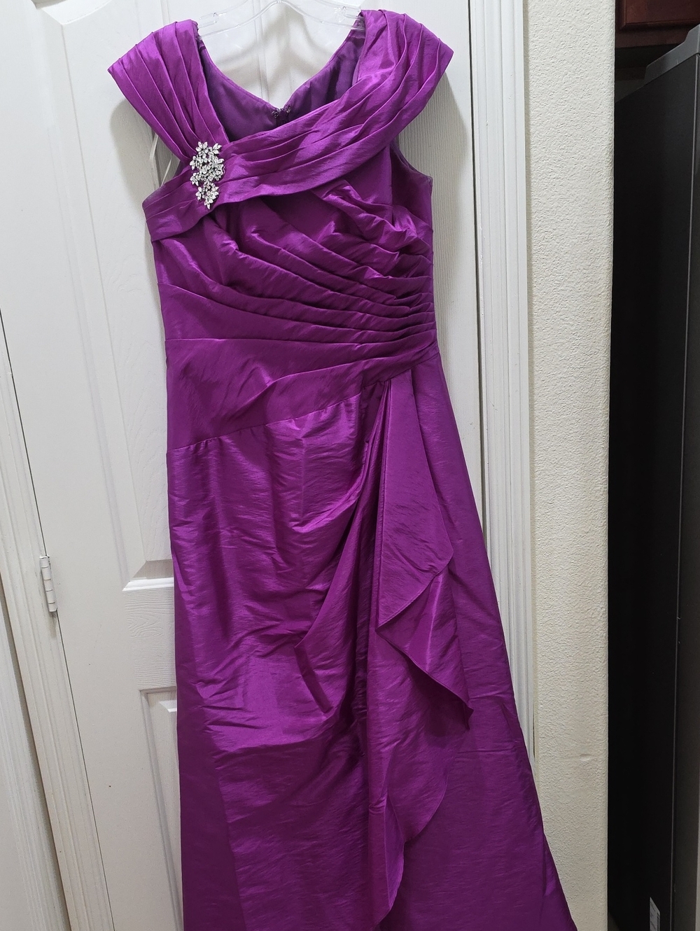 Elegant Purple Evening Gown with Draped Detail and Brooch